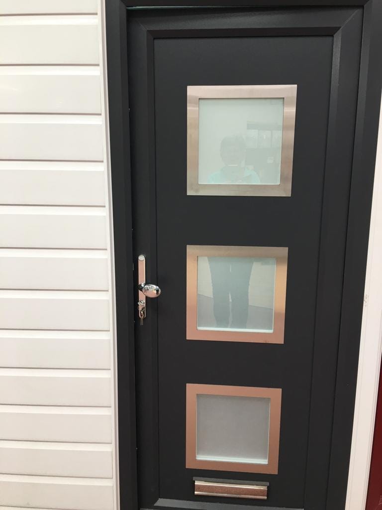 Black composite door with glass panels in Brightlingsea, Essex by A&E Window Doctor