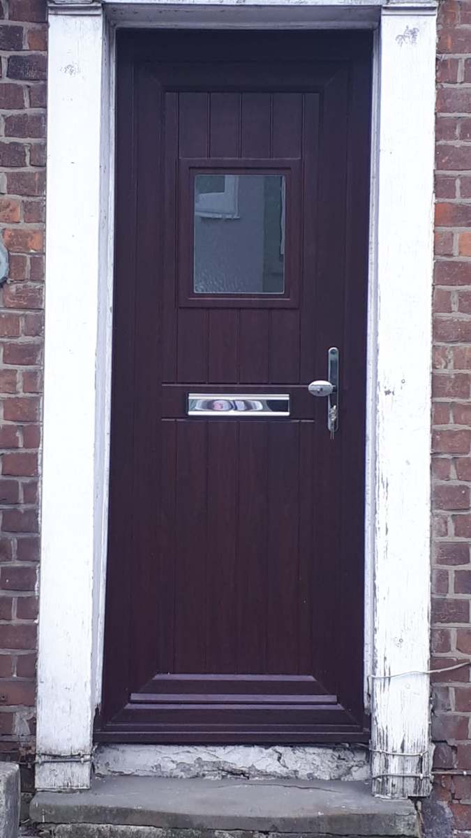 Dark composite front door fitted by A&E Window Doctor