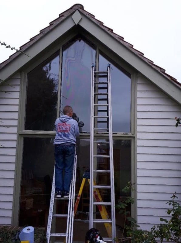 Ladder access repair work from the A&E Window Doctor gallery