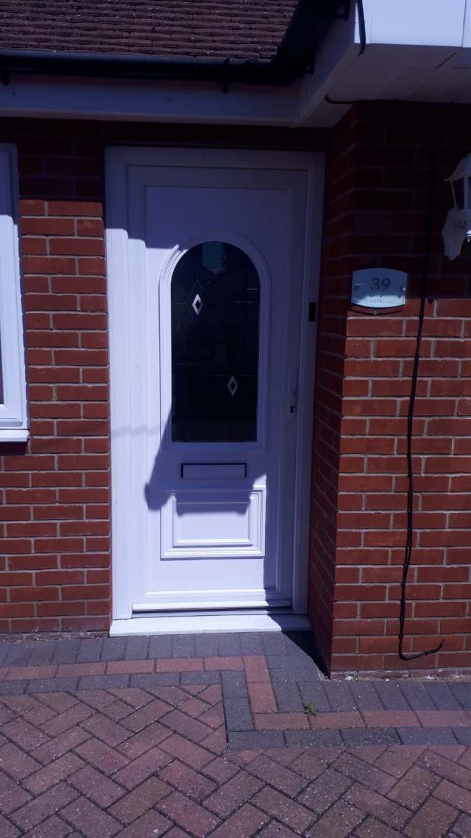White uPVC door fitted brick home in Witham, Essex by A&E Window Doctor